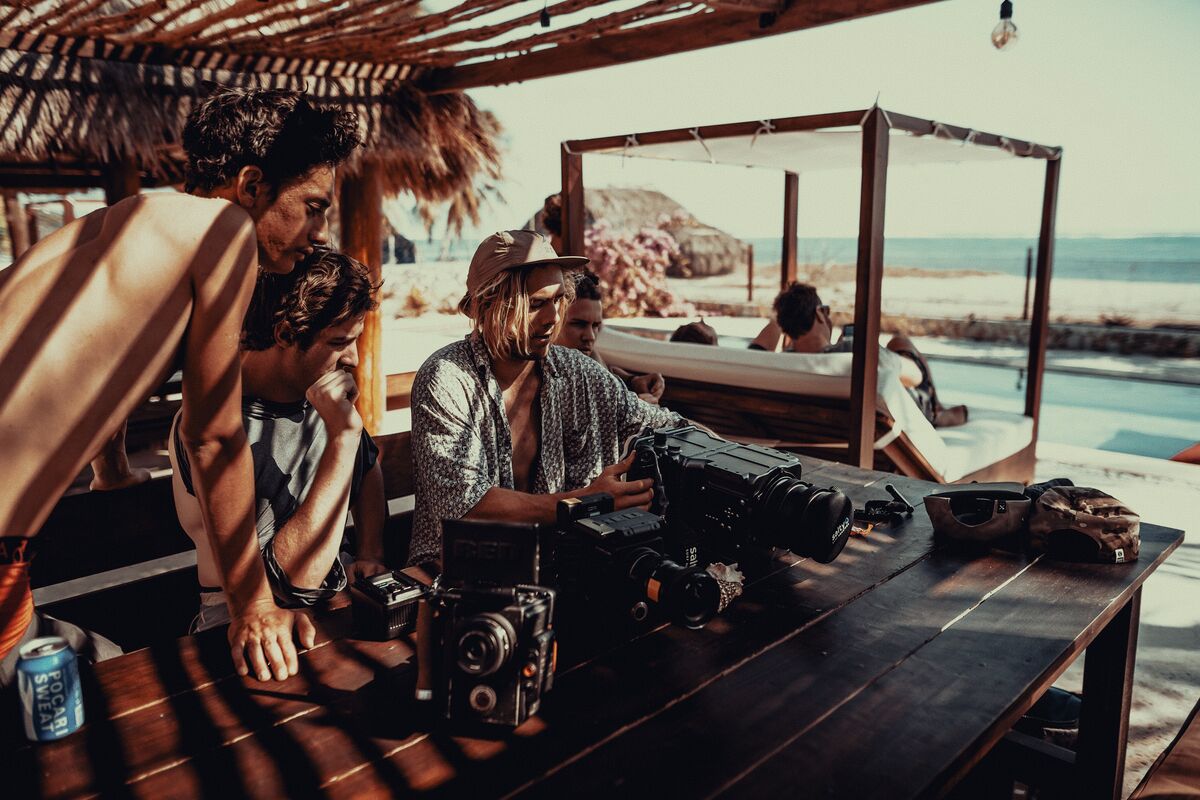 Crew working over cameras above the water